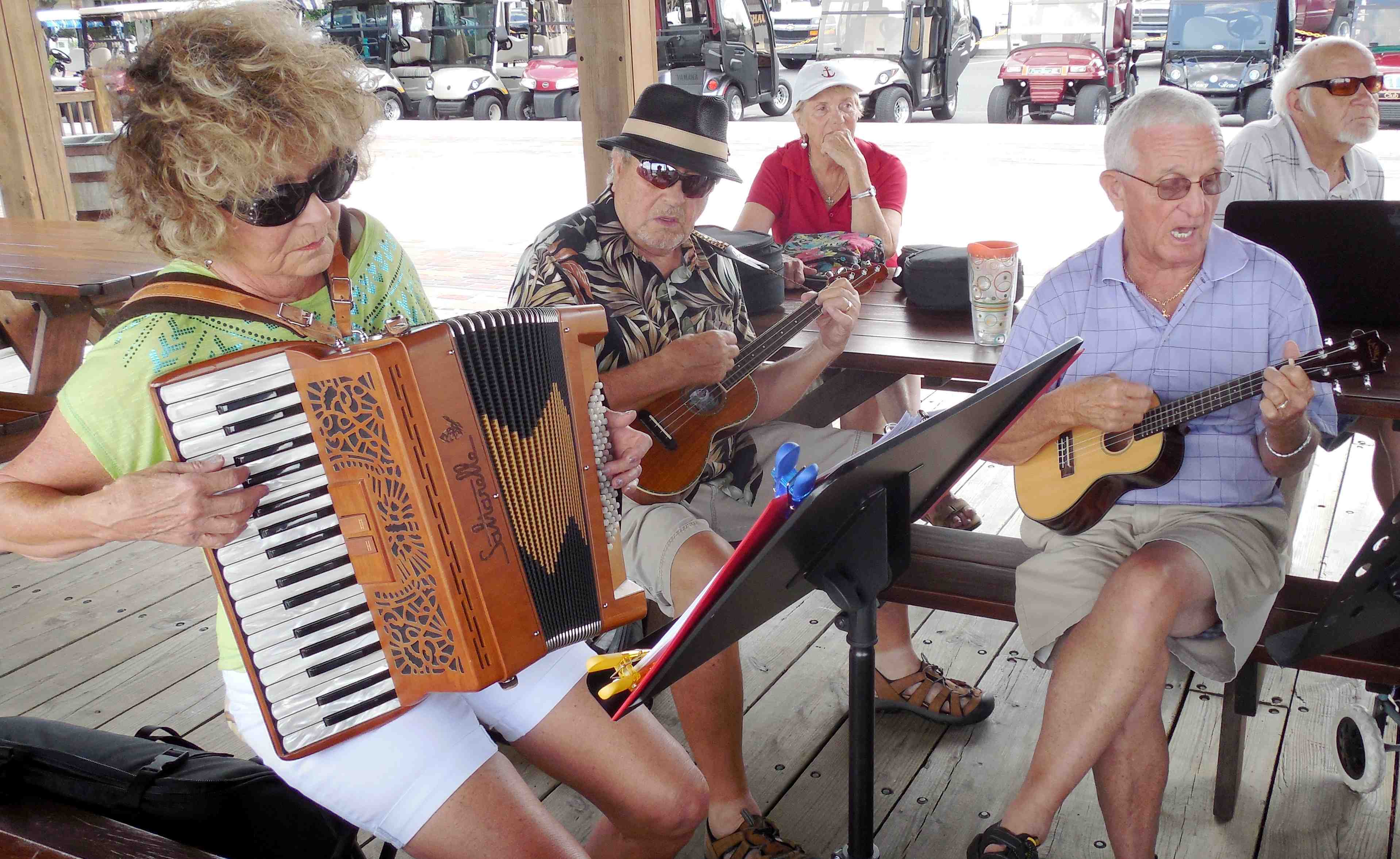 Ukulele Club takes practice outdoors on beautiful day in The Villages