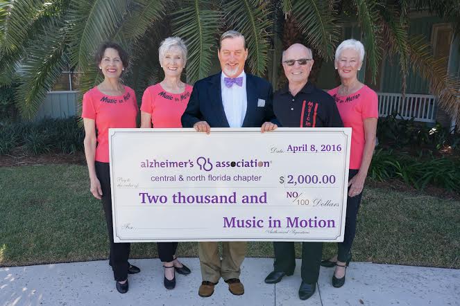 Music in Motion dance troupe presents checks totaling $4,000 to charities