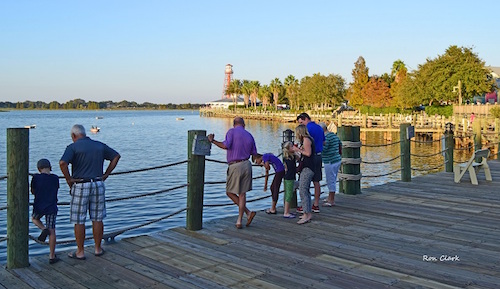 Visitors enjoying the boardwalk at Lake Sumter Landing