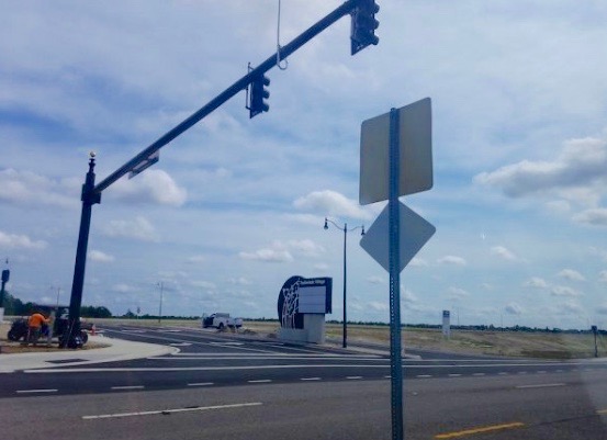 New stop lights erected along County Road 466A for Trailwinds Village