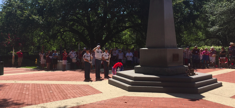 Villages Honor Guard presenting a wreath made by Connie Dunn at the Independence Day ceremony at Veterans' Memorial Park