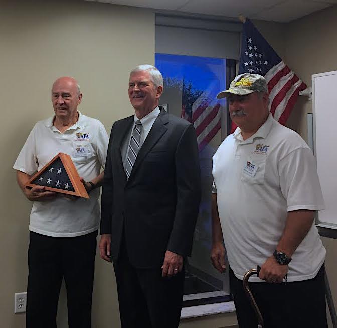 Congressman Daniel Webster is flanked by AFA President Howard Burke, left, and Vice President Anthony Arnold, right.