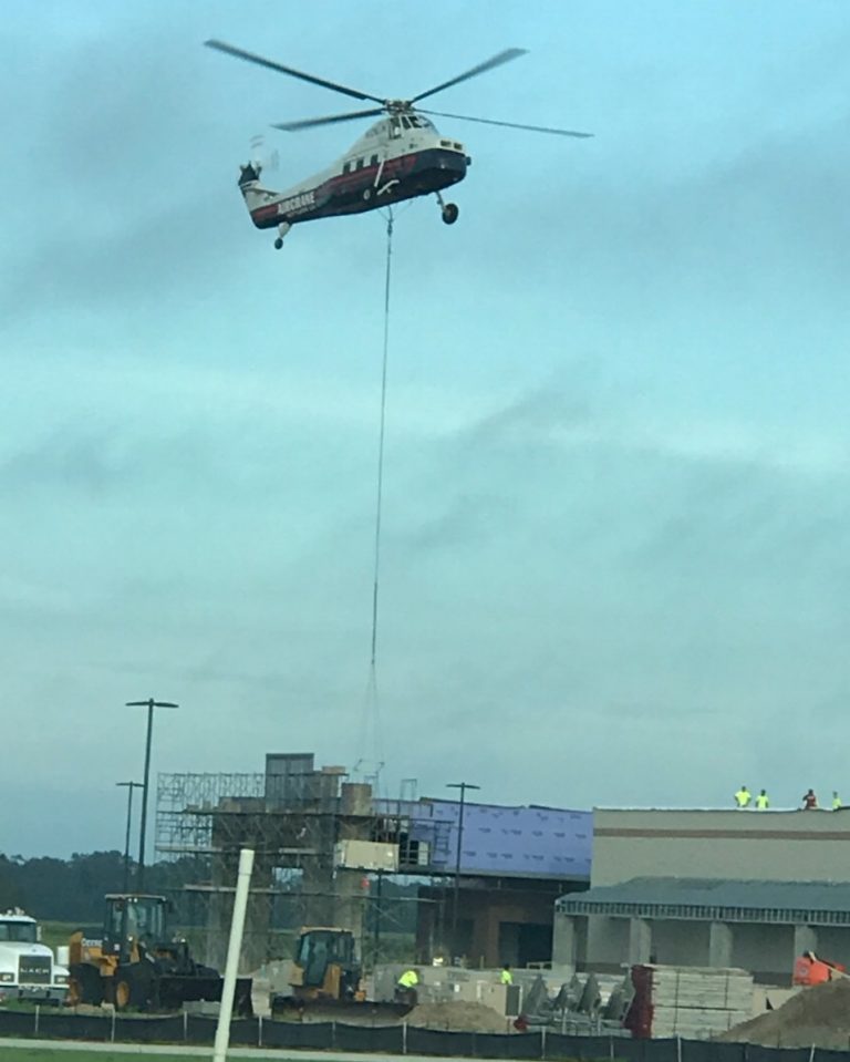 Helicopter lifting AC unit onto Lowe's (2)