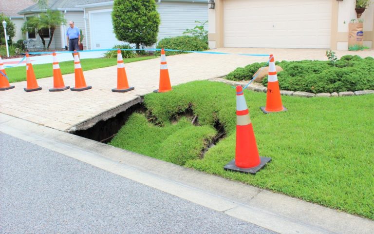 Sinkholes open up in front yard of Villages home following storm drain cleaning