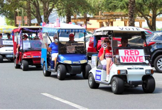 Villagers for Trump ride the ‘Red Wave’ with horn-honking golf cart parade