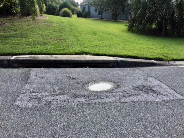 Sinkholes at storm drains in the Village of Virginia Trace