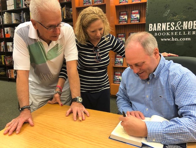 Congressman gunned down by sniper greeted by adoring crowd at book signing
