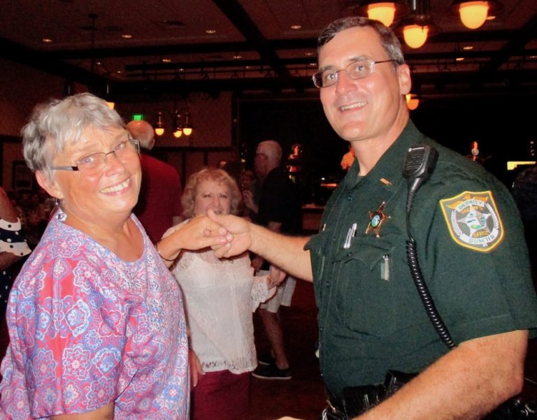 Villagers dance with sheriff’s deputies in event to make Christmas merrier for those in need