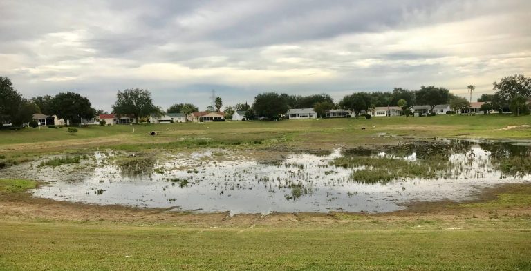 Sinkhole-damaged pond in Village of Alhambra draining again after recent $100,000 repairs