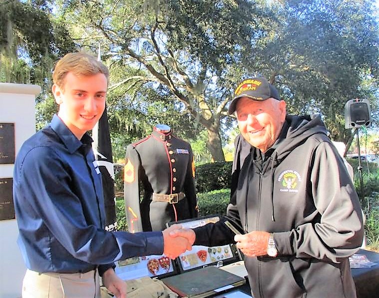 Teen chronicling World War II honors veterans during Villages Pearl Harbor ceremony