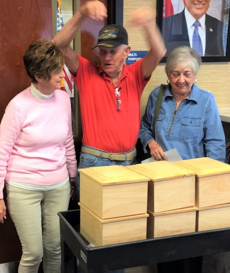 Villages woodworkers handcraft specially built urns for Florida veterans