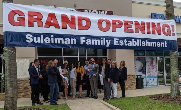 The Suleiman family celebrates the ribbon cutting of another one of their establishments