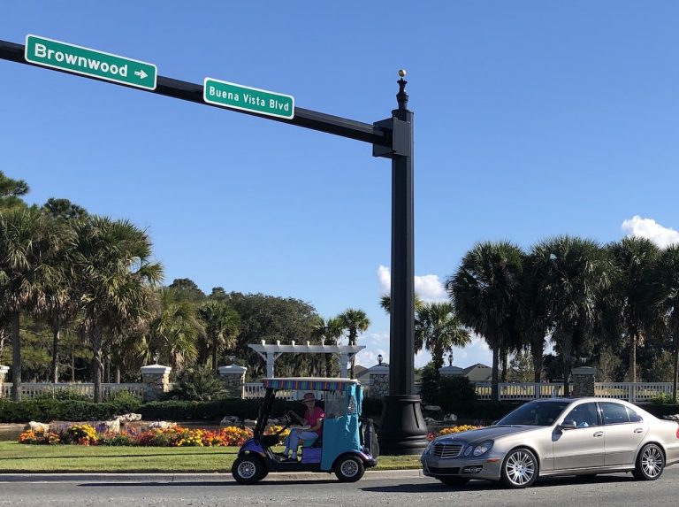 Woman in a golf cart strays onto busy roadway in The Villages