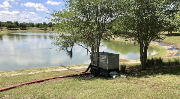 A large portable pump was installed to lower the water level in the retention basin.
