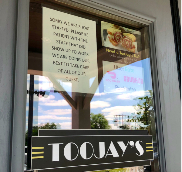 A sign at TooJays at Brownwood spells out the staffing shortage at the restaurant.