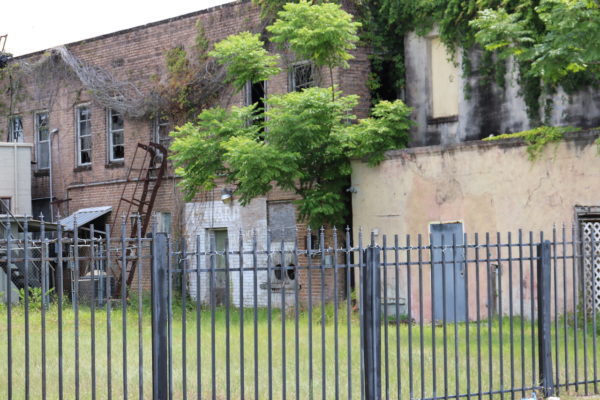 The property behind the buildings could be used for parking The property behind the buildings could be used for parking