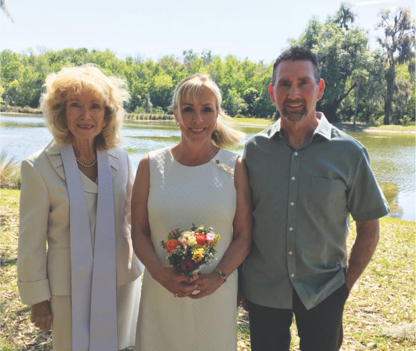 Ann Marie Acacio left is often asked to officiate at weddings in The Villages. She is with Suzanna and Jerry Hazen after their wedding near the Fenny Recreation Center.