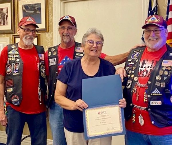 Vice Regent Tina Getz provides a certificate to Brian Parker of the Patriot Guard Riders. Also pictured are Doyle Schwab and Doug Mobley