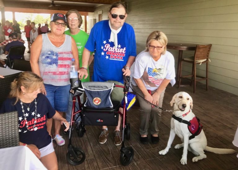 Chuck along with Patriot Service Dog Dakota and members of the Ocala Fraternal Order of Eagles who sponsored Dakota at the graduation ceremonies at Belle Glade Country Club.