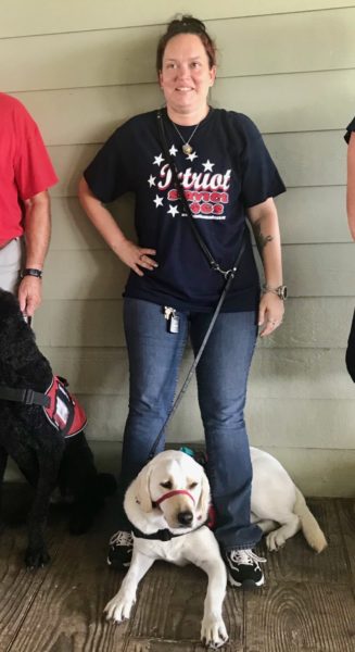 Smiling Kristy and her Patriot Service Dog Charlie at the graduation and hand over of the leads at the Belle Glade Country Club on Saturday July 17 2021.