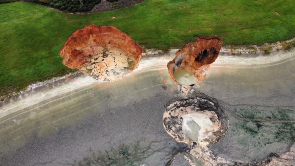 Three large sinkholes have drained a pond near the Moyer Recreation Center.