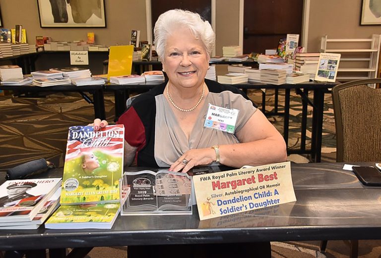 Author Peggy Best at a book signing for her award winning Dandelion Child book at the Florida Writers Association conference in 2019.
