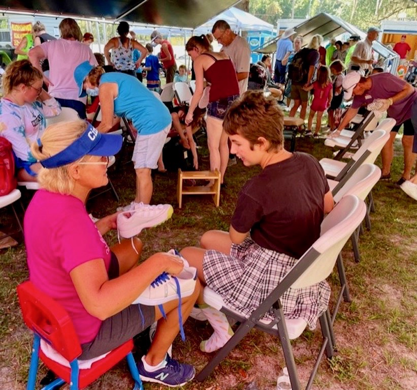 Cindy Halinski was fitting shoes at the back to school bash