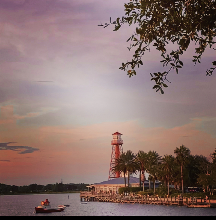 Gorgeous Sunset Reflecting On The Lighthouse At Lake Sumter Landing
