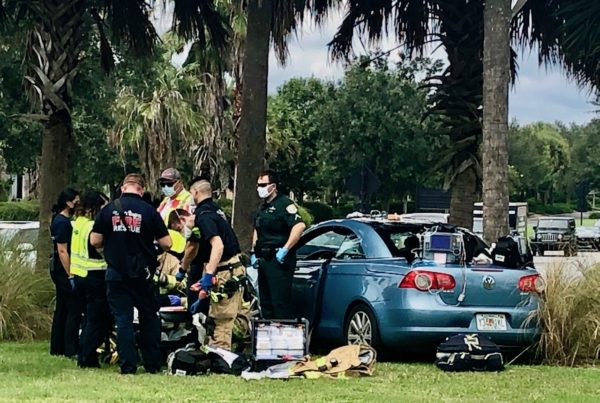 Emergency personnel tend to a patient after an accident Thursday afternoon in the roundabout at Morse Boulevard and Moyer Loop