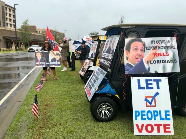 Protesters greeted Gov. Ron DeSantis upon his arrival Wednesday afternoon at the Brownwood Hotel Spa Protesters greeted Gov. Ron DeSantis upon his arrival Wednesday afternoon at the Brownwood Hotel Spa