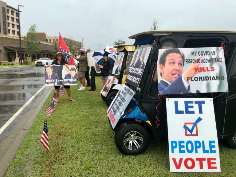 Protesters greet Gov. DeSantis upon his arrival at event in The Villages