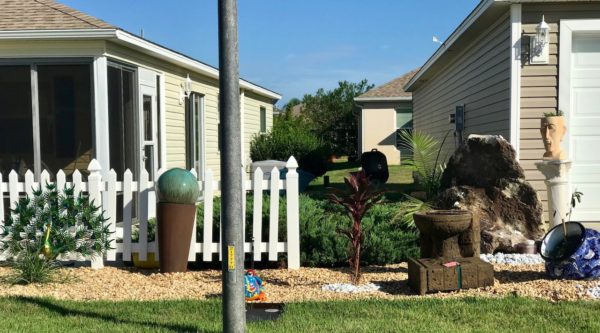 The yard ornaments at 1399 Viola Court are clearly encroaching on the neighbors property