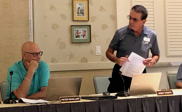 CDD 7 Supervisor Jerry Vicenti right looks at fellow PWAC member Peter Moeller seated before storming out of the meeting Monday morning at SeaBreeze Recreation Center.