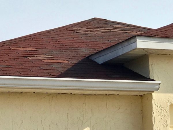 Shingles are missing from this roof at a home in the San Pedro Villas