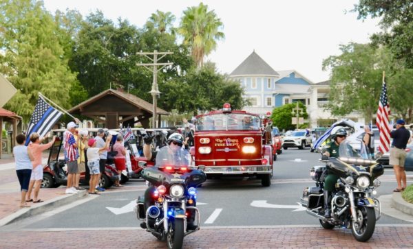 Villagers lined the Lake Sumter Square and cheered the Police and Fire units as they paraded around the Lake Sumter Landing Market Square.