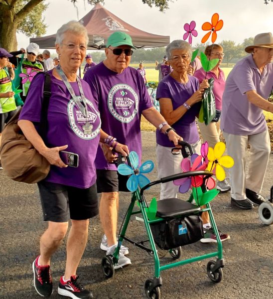 Walk participants cross the finish line at the 2021 Walk to End Alzheimers The Villages.