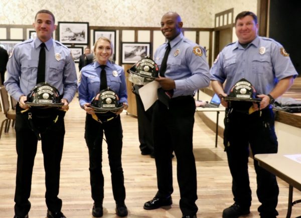 Firefighters from left David Quevedo Samantha Bell Machel Davis and Fire Inspector Christopher Battle show their new department helmets. Firefighters from left David Quevedo Samantha Bell Machel Davis and Fire Inspector Christopher Battle show their new department helmets.