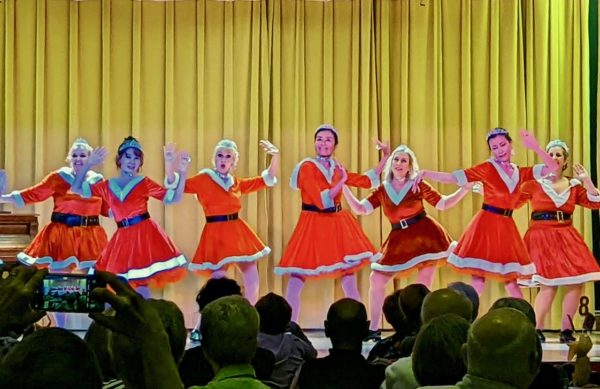 The Village Tappers in Santa suits performed to Santa Baby.