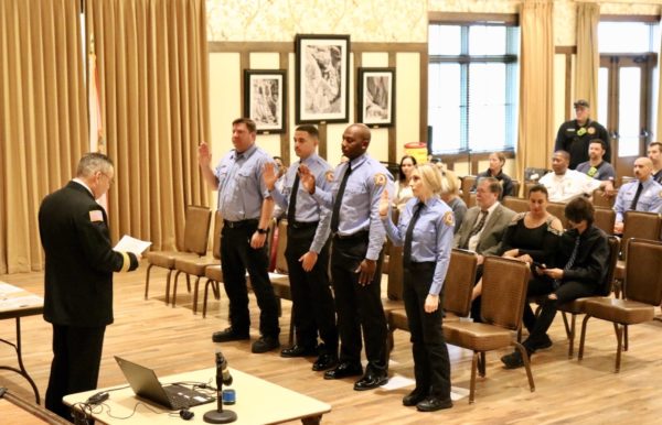 The newest class of firefighters take the oath of office prior to receiving their badges. The newest class of firefighters take the oath of office prior to receiving their badges.