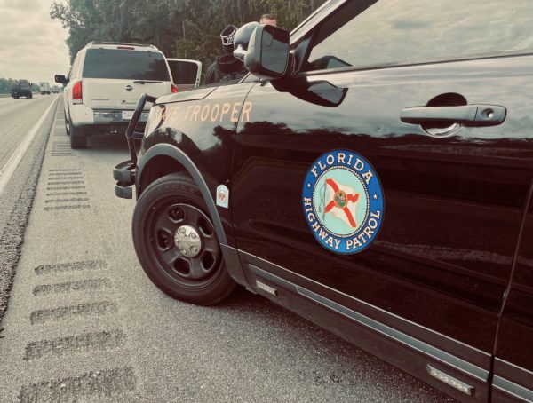 The white Nissan Armanda was stopped in Sumter County
