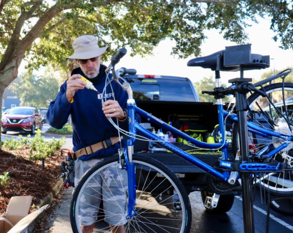 Dave Super, who works at the Santos Bike Shop as a professional bike mechanic, worked on several bikes Friday morning.