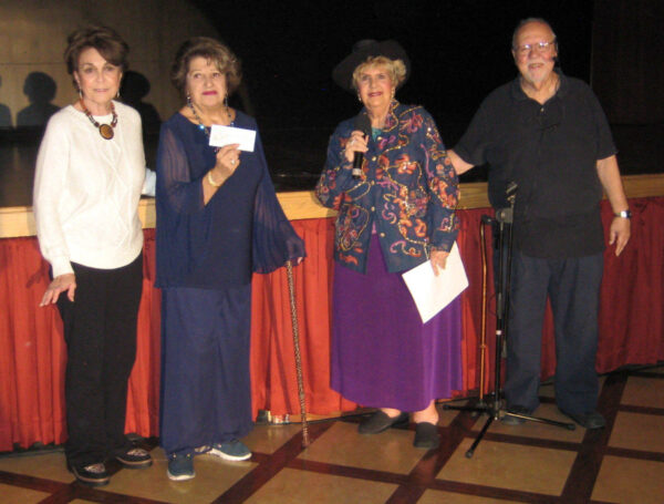 Geri Dempsey Gerri Pisccitelli of the Opera Club accept a 5000 check from Diana and Joe Arlt of Showcase of Talent from left.