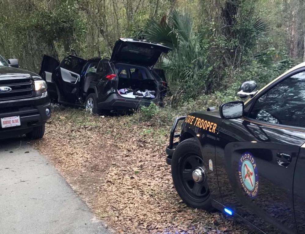 Guns and drugs were found in the vehicle abandeond by the suspects during the chase