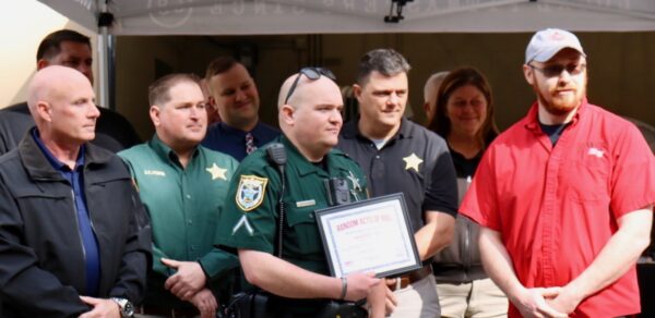 Deputy Jarod Souders center was honored Tuesday
