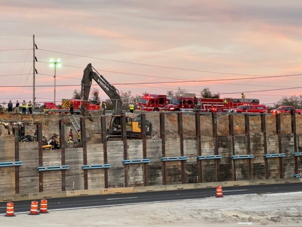 Heavy equipment was brought in early Wednesday evening in an attempt to rescue the trapped construction worker