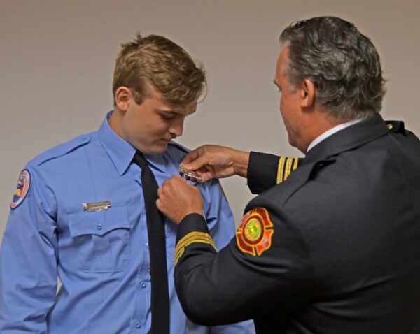 New firefighter Blake Normoyle was pinned by his father New firefighter Blake Normoyle was pinned by his father