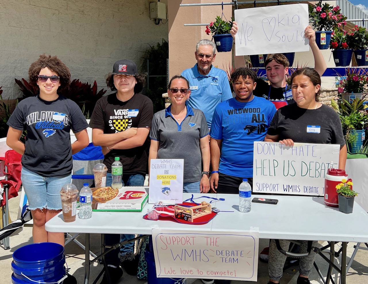 The debate team from Wildwood Middle High School was raising money Saturday at Lowes home improvement. Villager Joel Lemmer of the booster club is standing in the rear.
