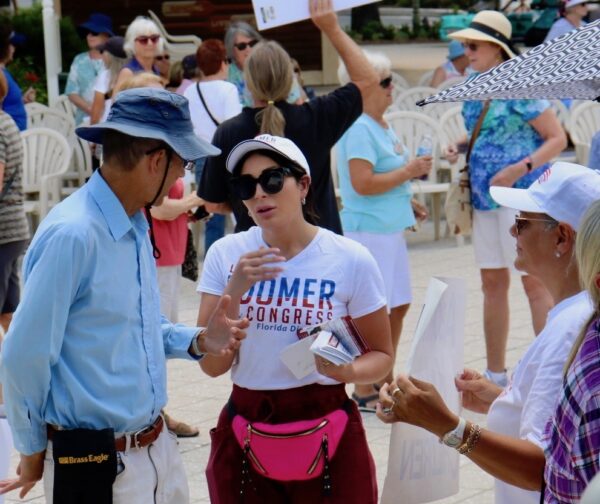 Laura Loomer center in sunglasses speaks to a member of the crowd at Saturdays competing demonstrations regarding the future of Roe v. Wade.