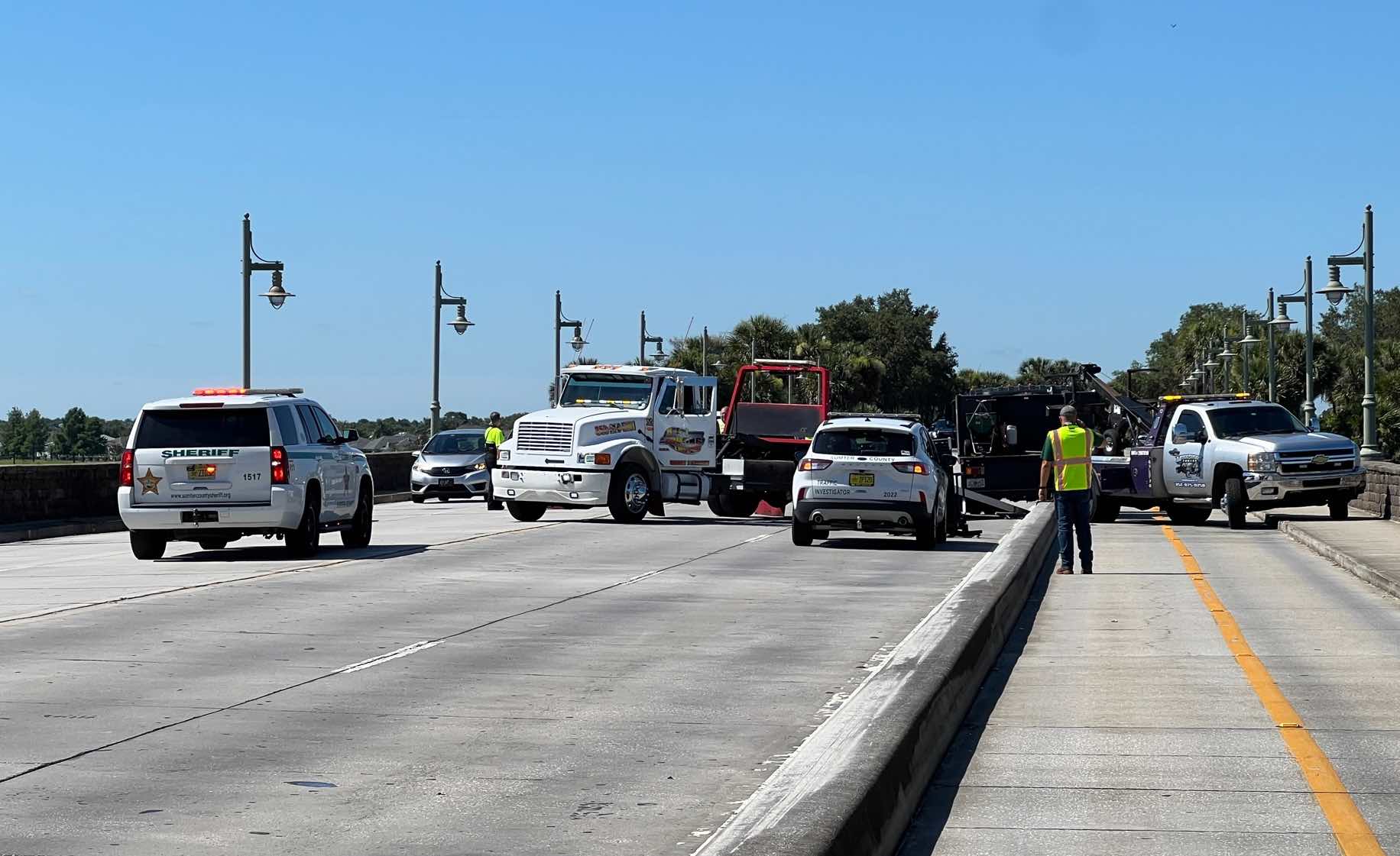 Emergency crews respond to an accident on Lake Sumter bridge involving a landscapers truck