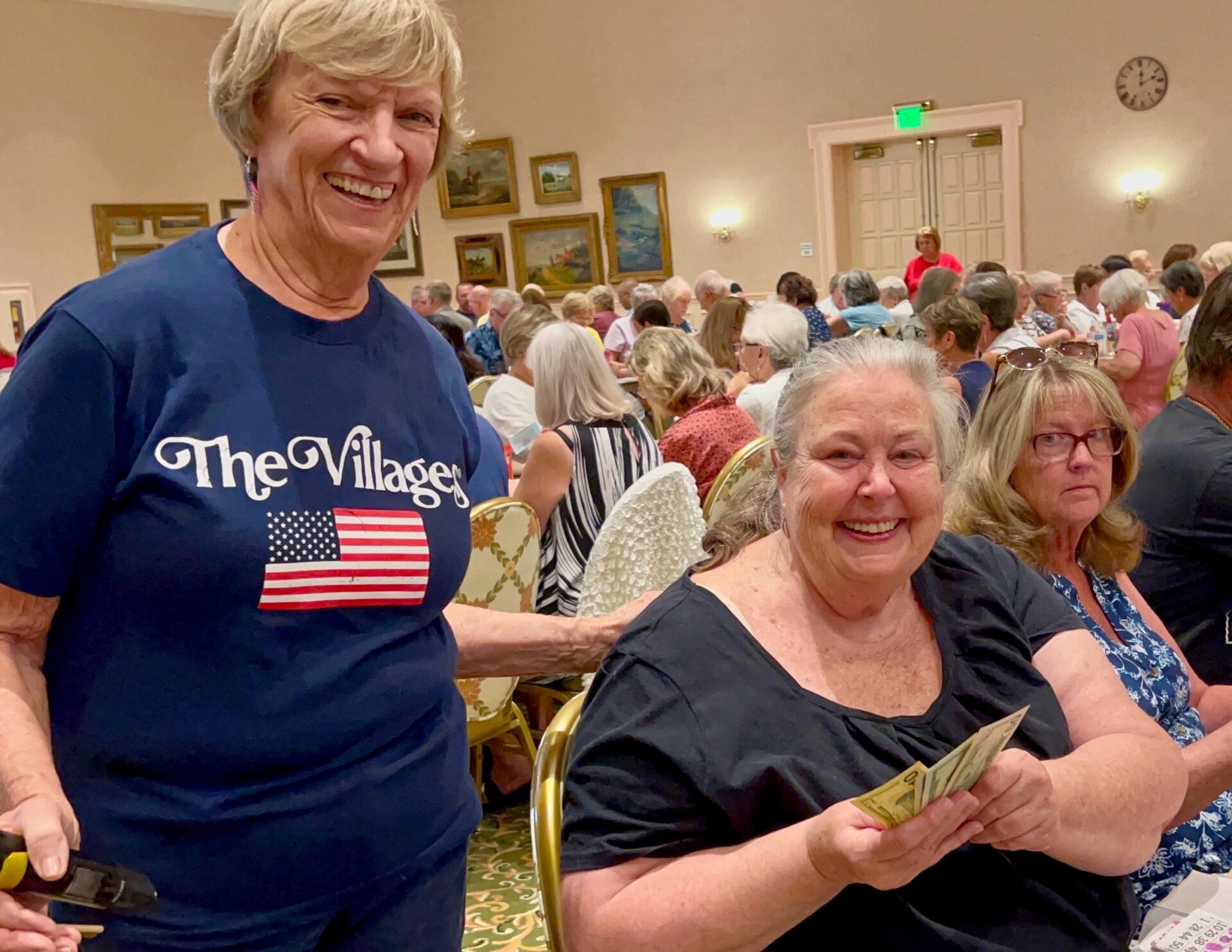 Susan Williams holding cash was the winner of the first game